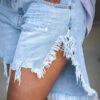 Fashionable Irregular Fringed Hem Denim Shorts